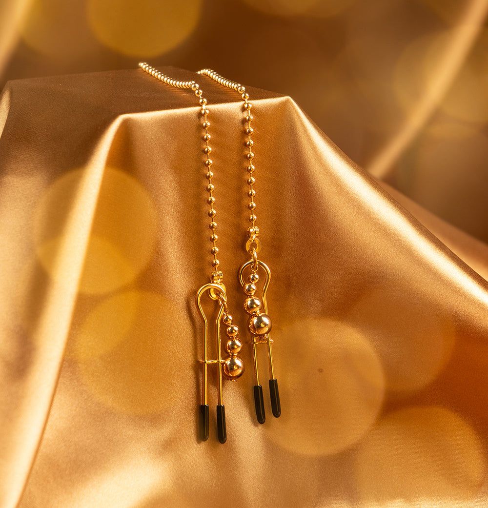 Nipple pliers with pendants and chain